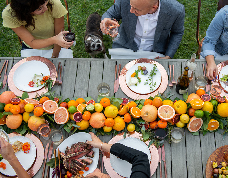 Citrus-themed dinner party group table setting at The Kitchen for Exploring Foods